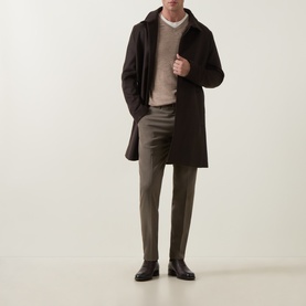Model wearing Tiger of Sweden Beige Melange wool V-neck, styled with dark brown overcoat, olive trousers and black leather shoes.