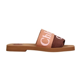 Chloe pink canvas slide sandal with white logo strap and tan flat sole, side profile view