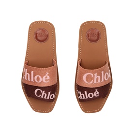 Chloe pink canvas slide sandals with embroidered logo strap, tan leather footbed, top-down view