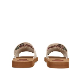 Chloe yellow leather slide sandals, tan flat sole, embroidered floral strap detail, rear view