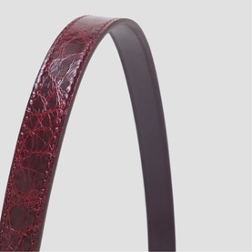 Maje burgundy croc-embossed bag strap with dark leather reverse, close-up detail shot