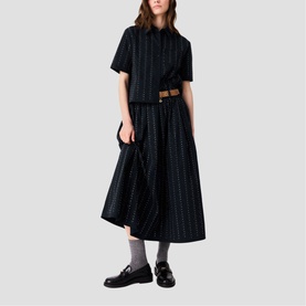 Model wearing Maje Womens French Dress in dark multi stripe, styled with a tan belt and black loafers