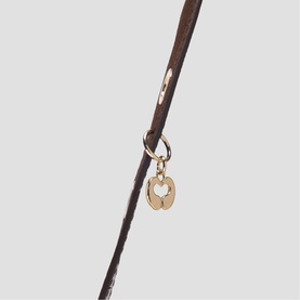 Maje dark brown leather strap with gold-tone ring and circular padlock charm detail.