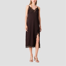 Model wearing dark brown slip midi dress with lace trim neckline and hem, styled with gold strappy heeled sandals