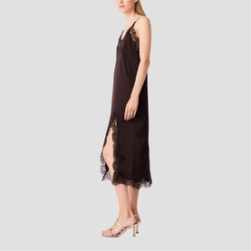 Model wearing dark brown midi slip dress with lace trim detailing at hem and neckline, styled with strappy gold sandals