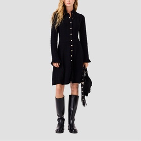 Model wearing Maje Womens French Dress in red, styled with black knee-high boots and carry a fringed bag