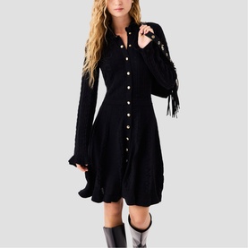 Model wearing Maje Womens French Dress in red, long-sleeve button-front style with fringe detail, styled with black knee-high boots