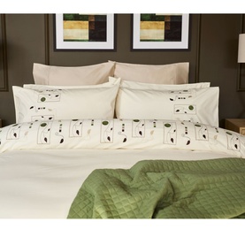 Belledorm Perth Duvet Set in ivory cotton with embroidered leaf and bird motif, styled on a double bed with green throw