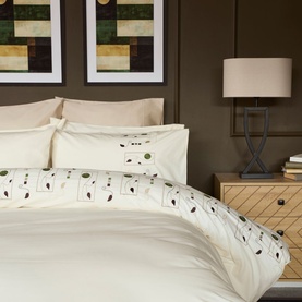 Belledorm Perth Duvet Set in ivory cotton, featuring embroidered leaf and berry detail, styled on a double bed with matching pillowcases.