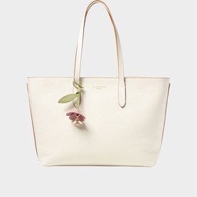 Aspinal of London ivory large tote bag with tan shoulder straps, gold-tone hardware, and floral charm detail