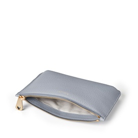 Aspinal of London Sky Blue pebbled leather pouch, open to show cream interior, with gold-tone zip hardware.