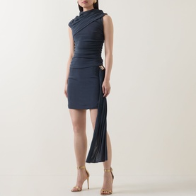 Model wearing Elliatt Marisol Ruched Top & Skirt Set in charcoal, featuring mock neck, asymmetric drape, pleated skirt panel and gold-tone hardware