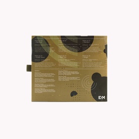 Escentric Molecules Fragrance Set, gold and black gift box with abstract circular pattern, rear view showing product details