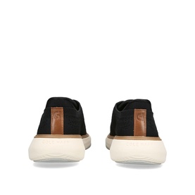 Cole Haan men's black canvas slip-on shoes, rear view, tan heel tab and cream rubber sole