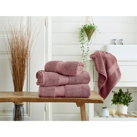 Karla Bree Portobello Towel in Powder Pink, 100% cotton, stack of three towels on wooden bench in bathroom setting