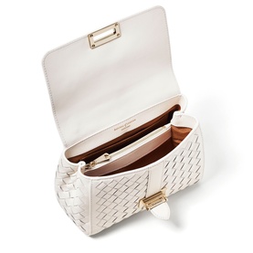 Aspinal of London Chalk White woven leather bag, open top view showing tan interior, gold-tone hardware and clasp fastening