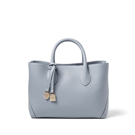 Aspinal of London sky blue pebbled leather tote bag with dual top handles, gold-tone heart charm, and structured silhouette.