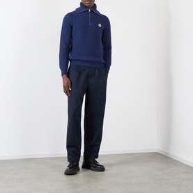 Model wearing Moncler Navy Wool Half Zip jumper with navy trousers and black loafers, full-length view.