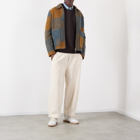 Model wearing NN07 Dusky Port cotton sweatshirt, styled with patchwork wool jacket and cream tailored trousers