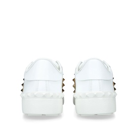 Valentino beige leather platform trainers with gold pyramid studs along sole edge, rear view