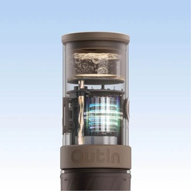 OutIn Mino Portable Espresso Machine in grey, cross-section view revealing internal components including filter and heating layers.