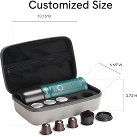 OutIn Nano Portable Espresso Machine Forest Green Bundle in open grey travel case, showing green device, capsule holders, and pod accessories