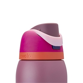 Owala water bottle close-up showing flip-top lid in pink, mauve and orange with lock detail