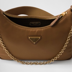 Prada Accessories brown nylon half-moon bag with gold-tone chain strap and triangle logo plaque, open zip top view