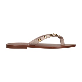 Valentino beige leather flip flop sandal with gold pyramid studs on strap and tan flat sole