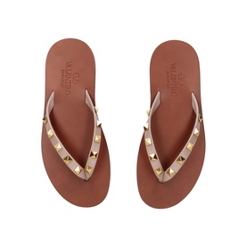 Valentino beige flip flops with gold Rockstud embellished straps and tan flatform sole, overhead view