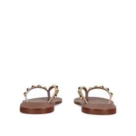 Valentino beige leather flat sandals, rear view, gold Rockstud embellishments on straps, tan leather sole