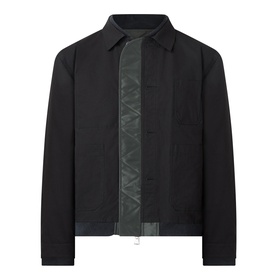 SACAI Reversible Bomber Jacket in black, shown open revealing quilted khaki lining, point collar, zip and button placket, dropped shoulders