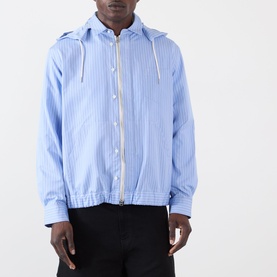 Model wearing Sacai light blue stripe cotton hoodie with zip fastening, drawstring hood, and elasticated hem.