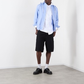 Model wearing Sacai L/Blue Stripe hoodie with white tee, black shorts, and black loafers with white socks.
