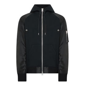 SACAI black cotton and nylon hoodie with zip front, chest pockets, raglan sleeves, and ribbed hem and cuffs