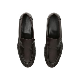 Ganni brown leather loafers with stitched apron toe, overhead flat lay view showing smooth upper and welt sole detail