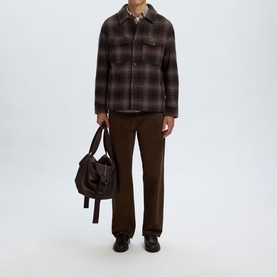 Model wearing Selected Casual Jacket in Delicioso Navy/Grey plaid check, styled with brown trousers, tote bag and black loafers