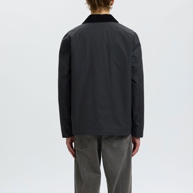 Model wearing Selected Dark Shadow casual jacket with black corduroy collar, styled with grey trousers, rear view