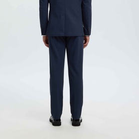 Model wearing Selected dark navy suit trousers, rear view, styled with matching suit jacket and black dress shoes.