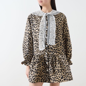Model wearing Sister Jane multi leopard print mini dress with lace collar detail and puff sleeves, styled with matching shorts