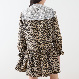 Model wearing Sister Jane Dress in leopard print with contrast lace-trim oversized collar, long sleeves, rear view shown