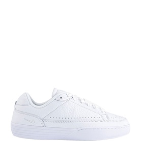 Nike white leather low-top trainers with perforated toe box, brogue-style detailing, and white rubber sole.