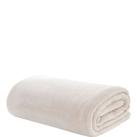 The Lyndon Company cream throw, neatly folded, showing soft plush texture and clean finish.