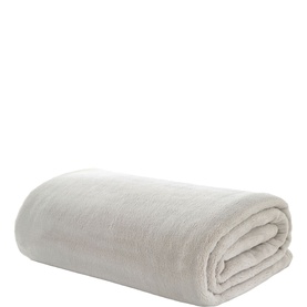The Lyndon Company Natural throw, neatly folded, soft plush texture in a warm off-white tone