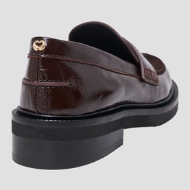 Maje dark brown patent croc-effect loafer, back view showing gold logo hardware and black chunky sole