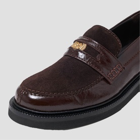 Maje dark brown suede and patent loafer with gold-tone hardware detail on saddle strap, black rubber sole.