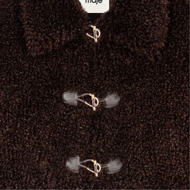 Maje dark brown teddy fleece jacket close-up showing gold-toned toggle fastenings with black leather loops