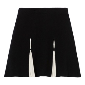 Claude Pierlot black mini skirt with flared silhouette and contrast cream panel inserts at front hem