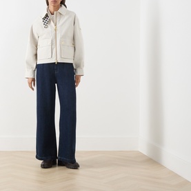 Model wearing Barbour International moonbeam jacket with zip fastening and patch pockets, styled with wide-leg navy jeans and dark loafers