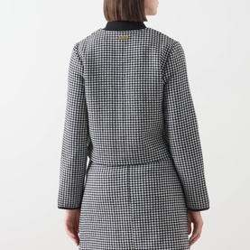 Model wearing Barbour International Halina Gingham Zip Jacket in multi, black and white gingham, cropped length, back view, styled with matching